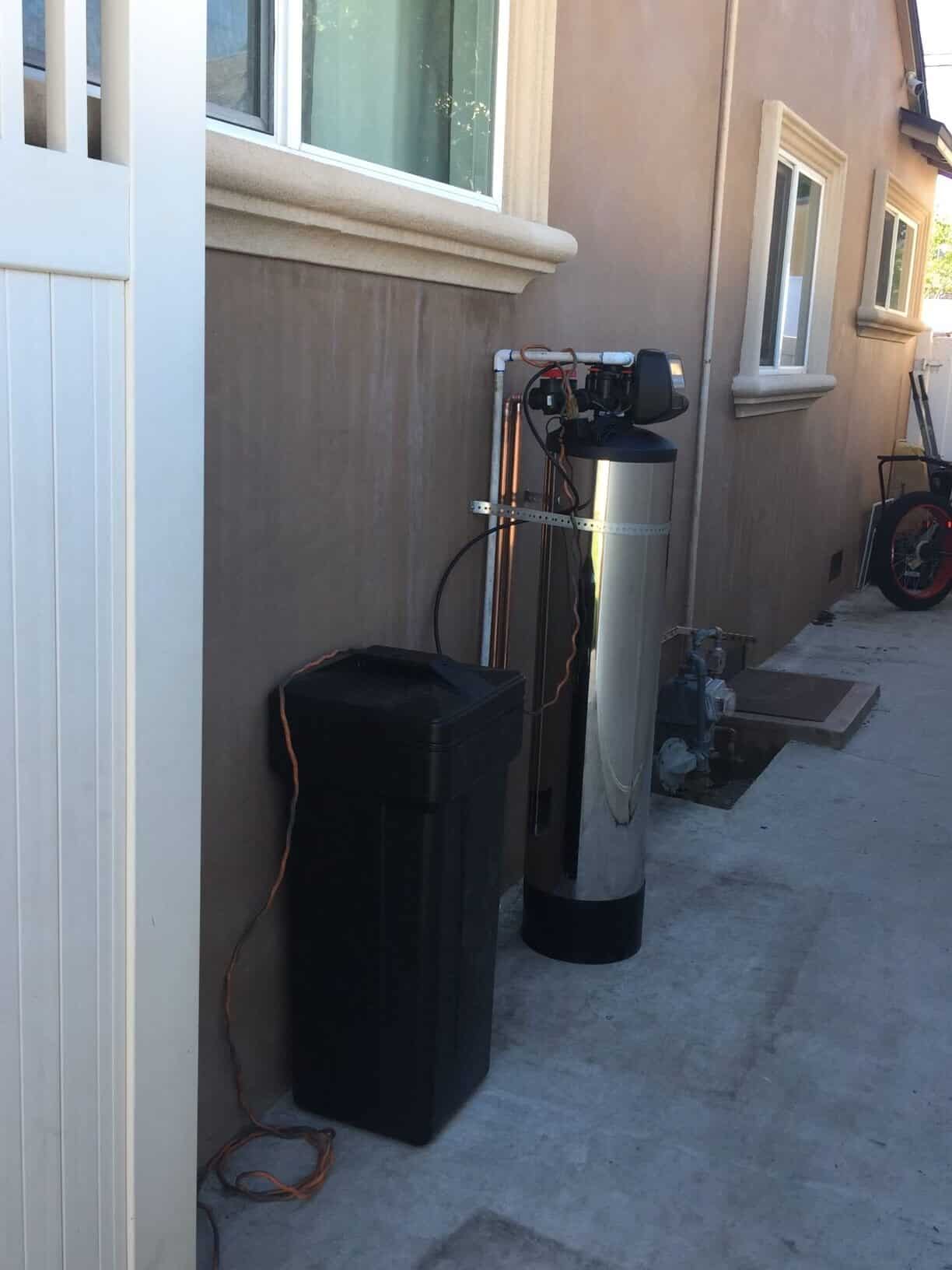 IMG_0445 Side view of the praz hard water treatment system in a backyard near the los angeles area